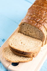 Toast bread slices on the wooden cutting board