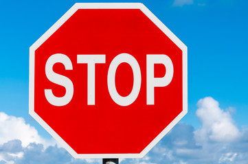 Stop sign against a blue sky.
