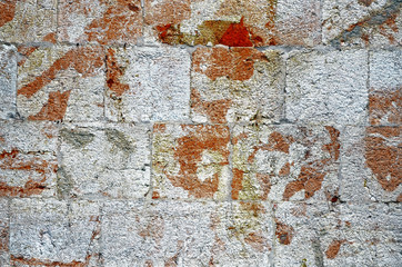 Stone wall near position red white color