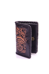 One purse, genuine leather with embossing ,black brown colors,Fashionable men's accessory To store money on a white background