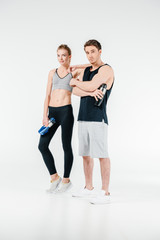 Obraz na płótnie Canvas couple with fitness shakers
