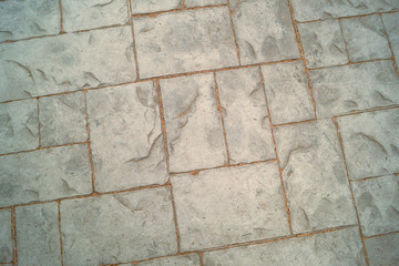 Grey paving slab different size on a walking path