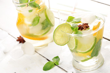 Jug with Lime and Orange Fruit Water with ice