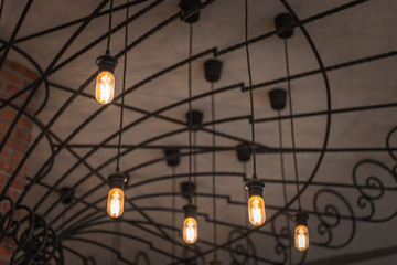 group of hanging lights in coffee shop with shallow depth of field