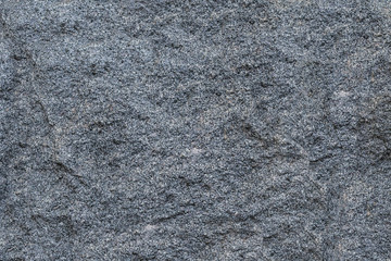 Texture gray granite rough untreated natural stone with white impregnations background natural...