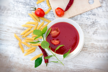 Tomato soup, tomato sauce and pasta for delicious meal - healthy vegetarian food