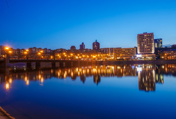 Fototapeta na wymiar Night city reflection on the river