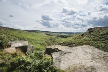 Beautiful vibrant landscape image of Burbage Edge and Rocks in Summer in Peak District England