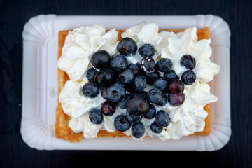 waffle with whipped cream and berries