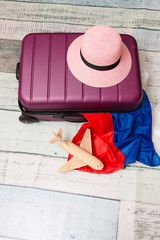 Hat, suitcase, flag and airplane