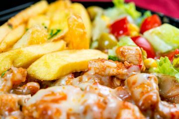 Fresh chicken steak with tomatoes and french fries