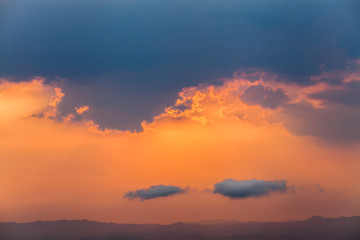 colorful dramatic sky with cloud at sunset.