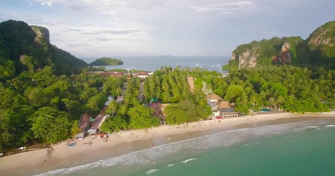 Tourists on Railay West Beach, Krabi, Southern Thailand, Descending Drone Approach Shot
