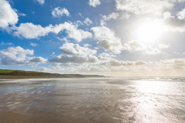 Fototapeta na wymiar Clouds over the beach at seaside, panoramic view