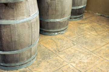 Fototapeta premium wine fermentation,Old wooden barrels and tanks for processing wine