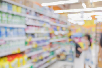Abstract blur supermarket shelves in grocery store