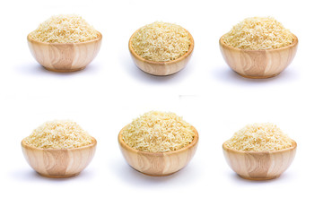 Brown rice in wooden bowl on a white background