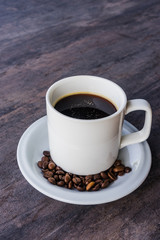 Black Coffee in a white cup set and coffee been