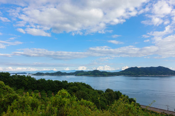 Fototapeta na wymiar islands under the blue sky on Setonaikai sea in Ehime, Japan