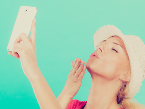 Woman taking picture of herself with phone