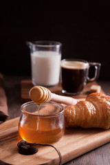 Breakfast with hot expresso and fresh croissant