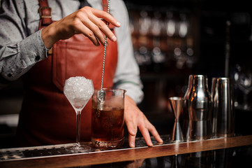 Bar-shaped spoon in the form of a finger