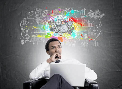 Pensive African American businessman, brain cogs