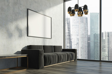 Concrete living room, black sofa, poster