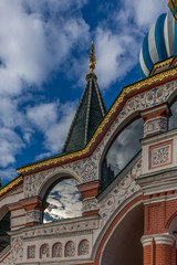 Fototapeta na wymiar Cloud reflections on the St. Basil cathedral in the red square in Moscow - 1