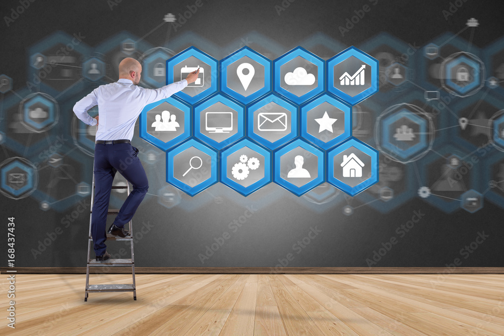 Poster businessman in front of a wall with application center displayed on a futuristic interface with tech