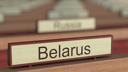 Belarus name sign among different countries plaques at international organization. 3D rendering
