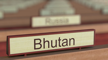 Bhutan name sign among different countries plaques at international organization. 3D rendering