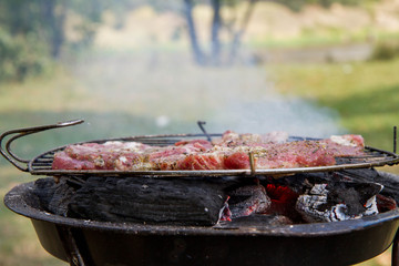 Chuck steak being grilled, outdoors