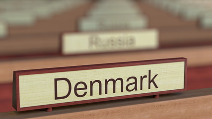 Denmark name sign among different countries plaques at international organization. 3D rendering