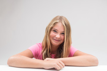 Fototapeta premium little girl grinning trying not to laugh