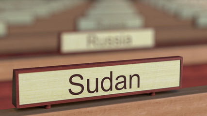Sudan name sign among different countries plaques at international organization. 3D rendering