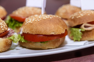 Mini burgers served on a plate