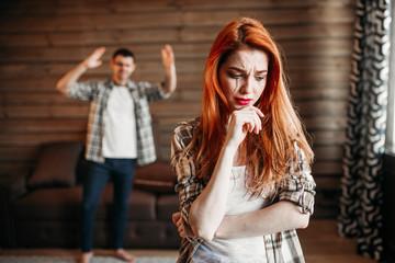 Fototapeta premium Family quarrel, couple in conflict, woman crying