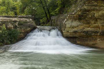 Fototapeta na wymiar Como Falls - A small waterfall on a creek.
