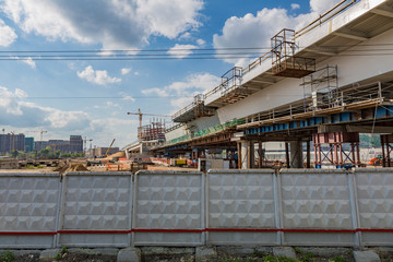 Large-scale construction of a massive transport bridge on a summer day
