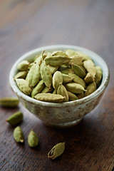 Dried cardamon pods in a dish
