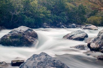Mountain river water silk. Forest stream. Slow shutter speed.