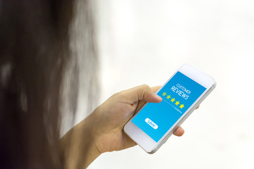 Customer review rating business concept, Woman hand using mobile phone