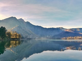 Lake and mountain in the morning. Rinjani Mountain, Lombok, Indonesia.