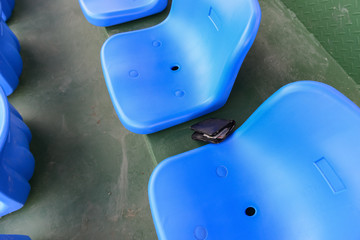 lost wallet lying on a stadium seat