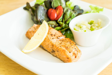 salmon steak with salad