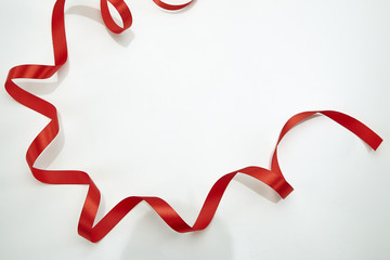Red curly ribbon isolated on white