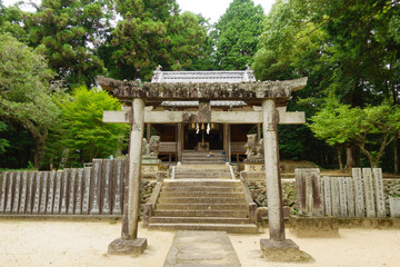 Stone "Torii" (gate of shrine) of an old shrine at Uchiko town in Ehime, Japan