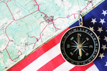 The compass on the American flag and a map of the area