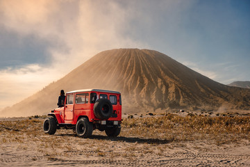 4x4 car service for tourist on desert at Bromo Mountain, Mount Bromo is one of the most visited tourist attractions in Java, Indonesia - obrazy, fototapety, plakaty